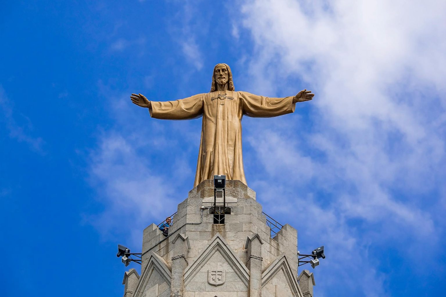 statue of christ the king under blue sky