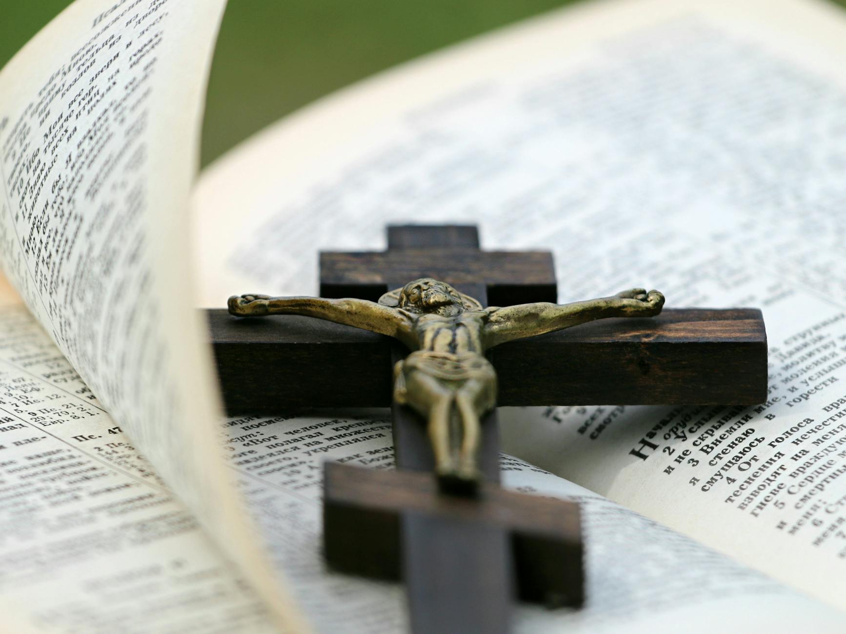 crucifix on top of bible